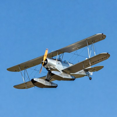 Silver Biplane Seaplane Flying