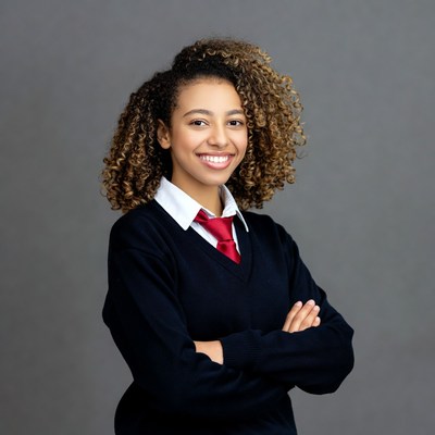 Smiling biracial girl in school uniform