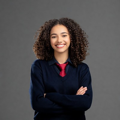 Smiling African-American girl in school uniform