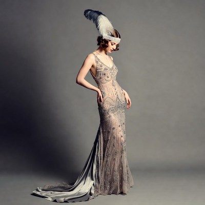 Woman in Beaded Flapper Gown with Feather Headband