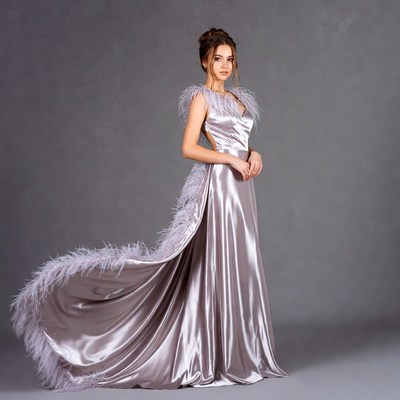 Woman in silver feather gown