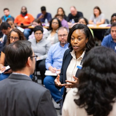 African-American woman speaking in classroom
