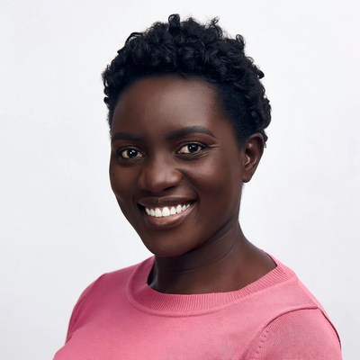 Smiling African woman in pink sweater