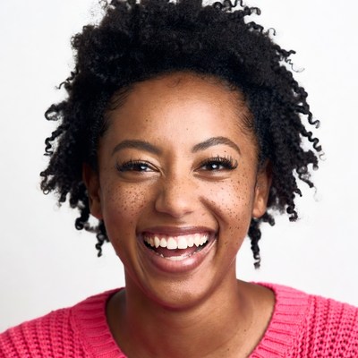 Smiling African-American woman in pink sweater