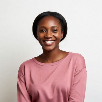 Smiling African-American woman in pink sweater