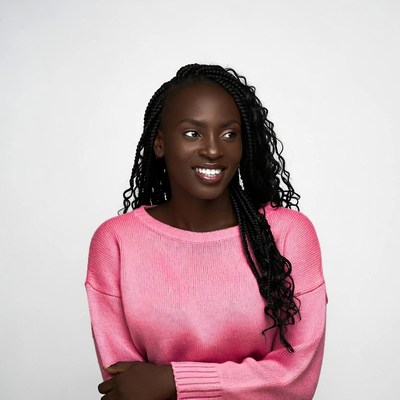African-American woman in pink sweater smiling