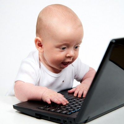 Baby using laptop computer