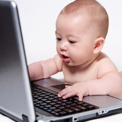 Baby using laptop computer
