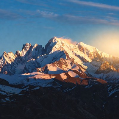 Snowy Mountain Peak at Sunset