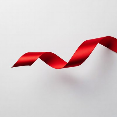 Red Ribbon Curled on White Background