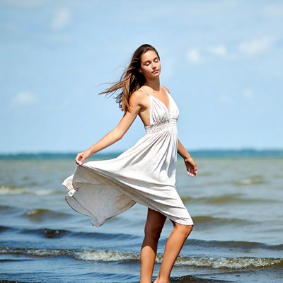 Woman in white dress at beach