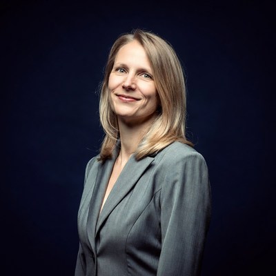 Smiling woman in gray suit