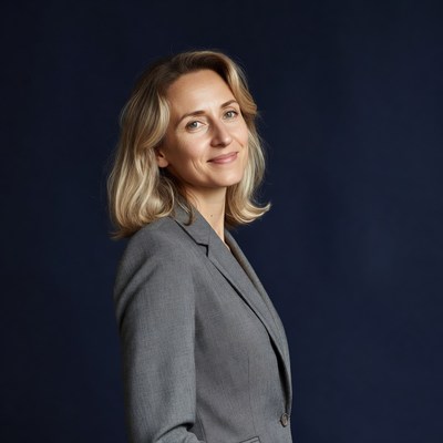 Smiling woman in gray suit