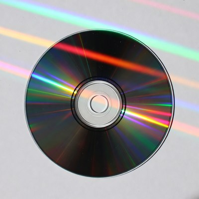 CD Disc with Rainbow Light Reflection