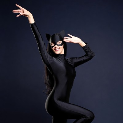 Woman in black catwoman costume posing
