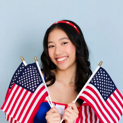 Asian girl holding American flags