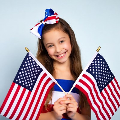 Girl holding American flags