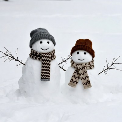 Two Snowmen Wearing Scarves and Hats