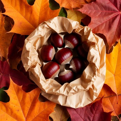 Chestnuts in Brown Paper with Autumn Leaves