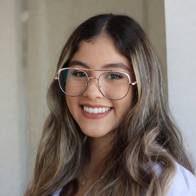 Smiling Latina woman with glasses