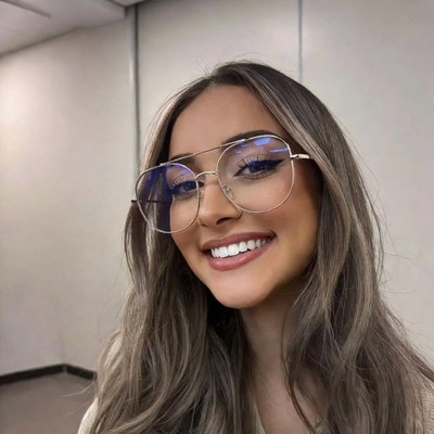 Smiling woman with blue light glasses
