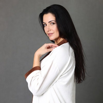 Woman in white robe side profile