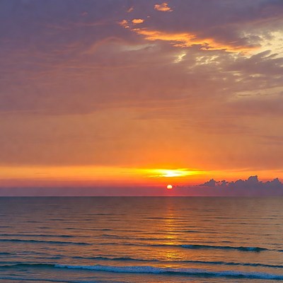 Sunset over ocean waves