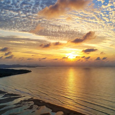 Sunrise over tropical beach and ocean