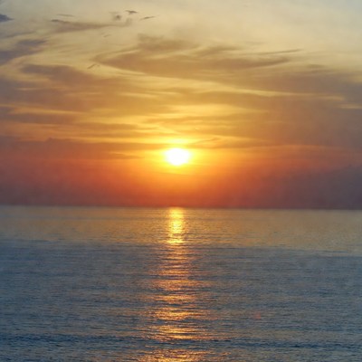Sunset over calm ocean