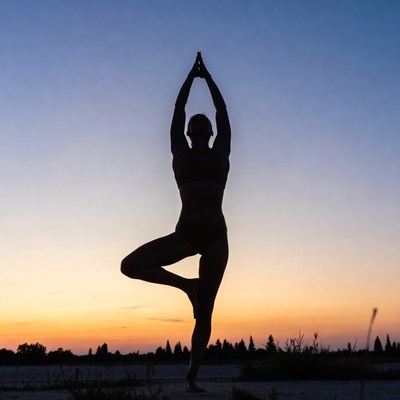 Woman in tree pose yoga silhouette