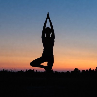 Woman in Tree Pose Silhouette at Sunset