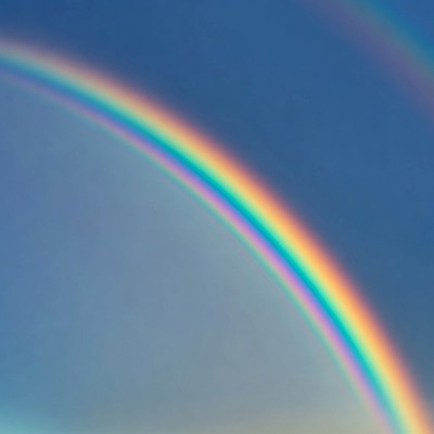 Vibrant Double Rainbow in Blue Sky