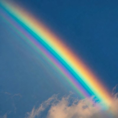 Vibrant Rainbow in Blue Sky