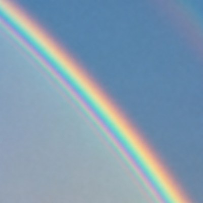 Vibrant Rainbow in Blue Sky