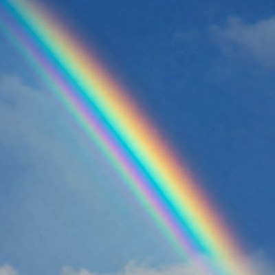 Vibrant Rainbow in Blue Sky