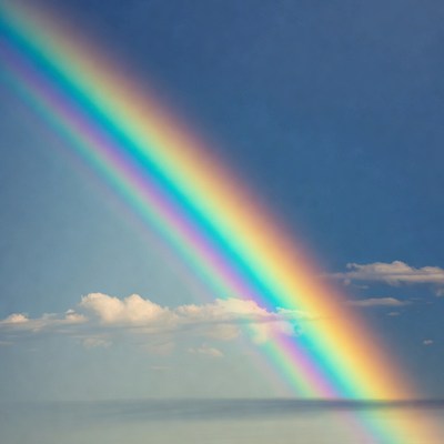 Vibrant Rainbow Over Blue Sky