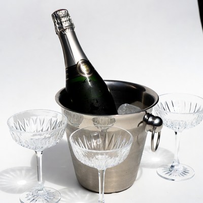 Champagne Bottle in Ice Bucket with Glasses