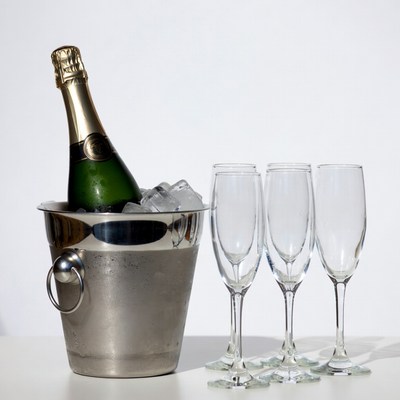 Champagne Bottle in Ice Bucket with Glasses