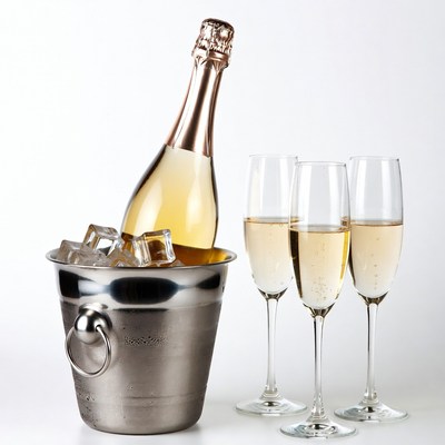 Champagne Bottle in Ice Bucket with Glasses
