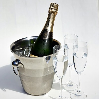 Champagne Bottle in Ice Bucket with Glasses