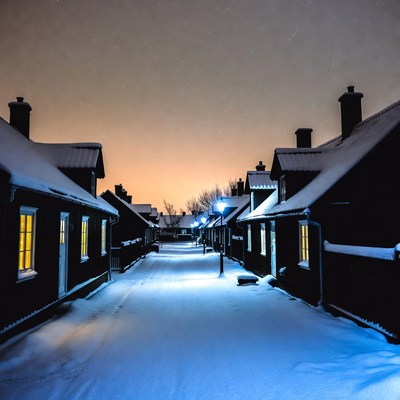 Snowy Village Street at Night