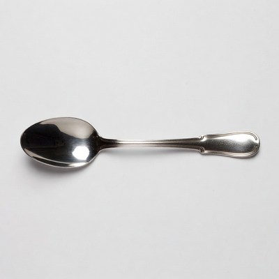 Silver spoon on white background