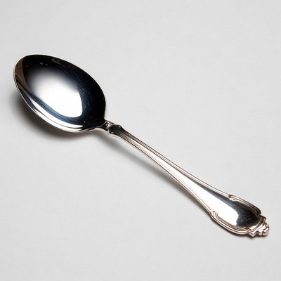 Shiny silver serving spoon