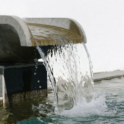 Concrete Waterfall Pouring into Pool