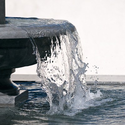 Water cascading from stone fountain