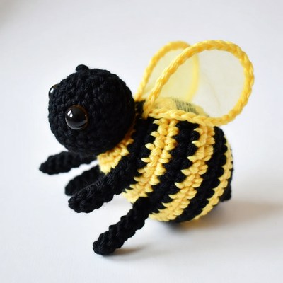 Crocheted black and yellow bee toy
