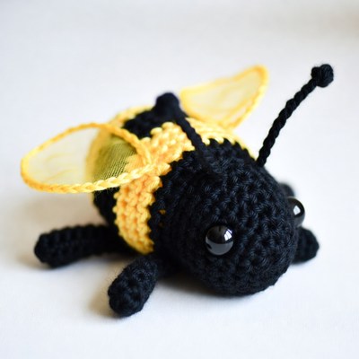 Crocheted yellow bumblebee toy