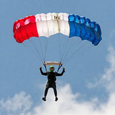 Skydiver with French flag parachute