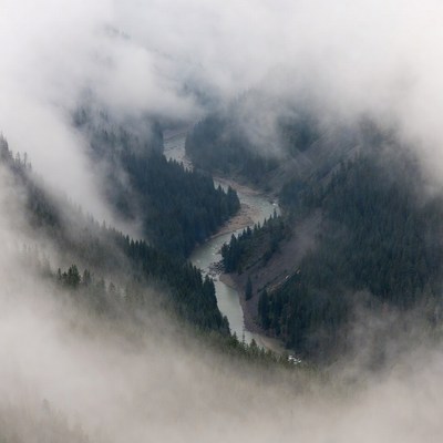 River winding through misty mountains