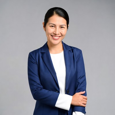 Asian woman smiling in navy blazer
